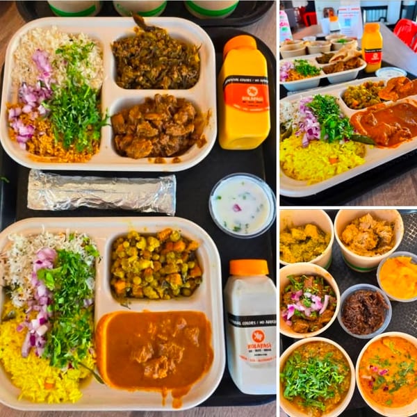 Multiple Kolatasi restaurant meals with various curries, rice, and drinks on black trays.