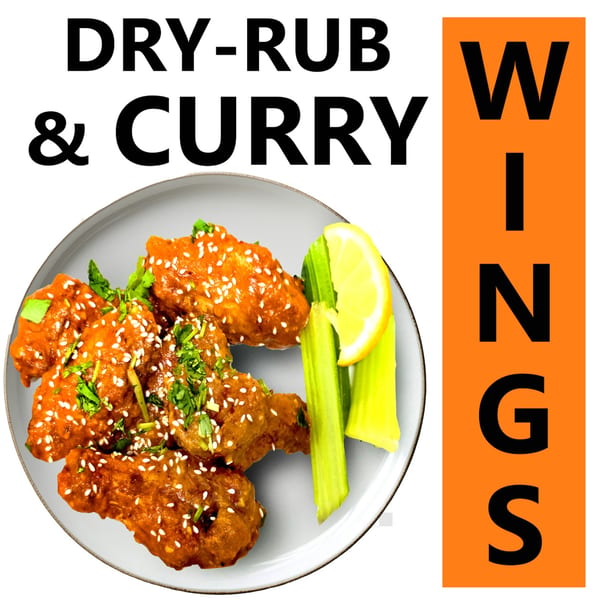 Dry-rub and curry wings with sesame seeds, cilantro, celery sticks, and a lemon wedge.